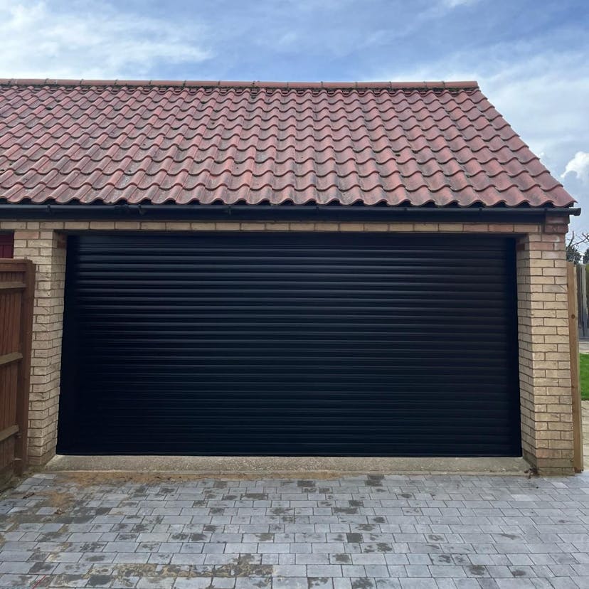 Image: A Double Black roller door complete with battery back up encase of power failure Fitted in Potton